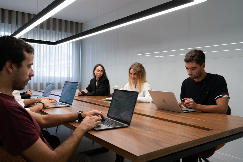 Main meeting room with a large table and chairs in a Porto shared office space